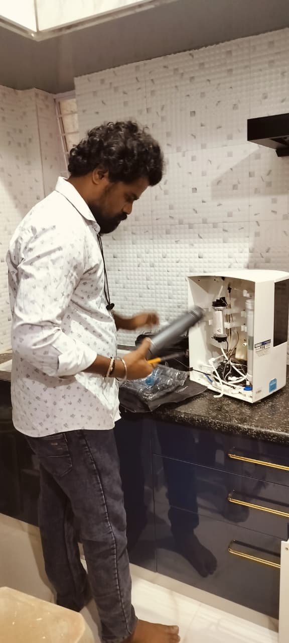 RO water purifier technician servicing a unit in HSR Layout, Bengaluru